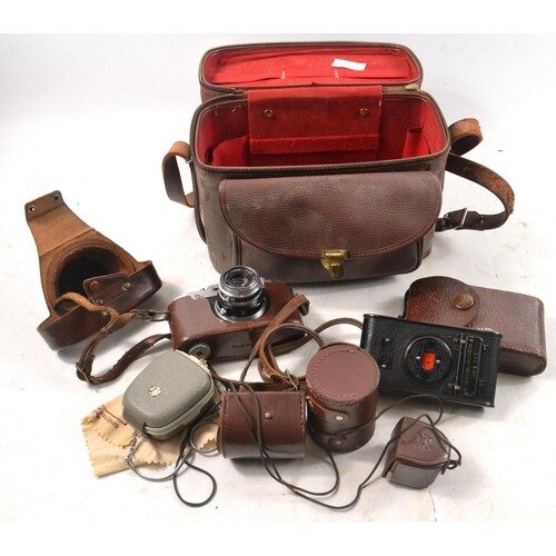 A large collection of high quality vintage cameras, lenses a...
