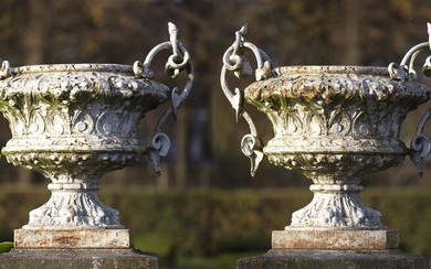 A large pair of French white painted cast iron twin handled urns