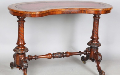 A mid-Victorian burr walnut kidney shaped stretcher table, the top inset with tooled red leather abo