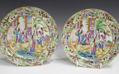 A pair of Chinese Canton famille rose porcelain plates, mid-19th century, each painted with a figura