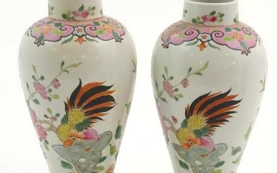 A pair of Chinese famille rose baluster vases decorated