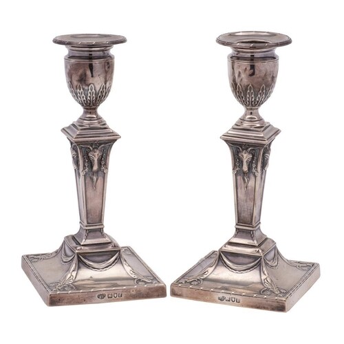 A pair of Edward VII silver candlesticks, maker Goldsmiths &...