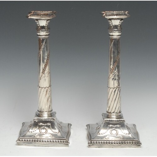 A pair of George III Old Sheffield Plate table candlesticks,...