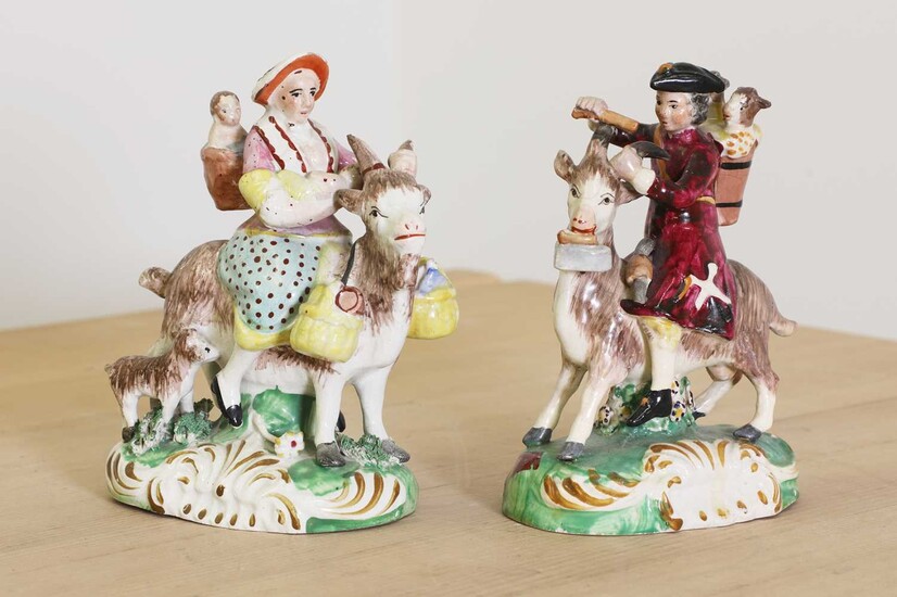 A pair of Staffordshire pottery figures