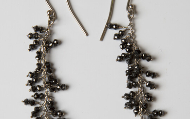 A pair of black diamond pendant tassel earrings, unmarked, length 7cm.