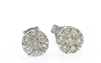A pair of diamond ear studs each set with numerous brilliant-cut diamonds weighing a total of app. 1.01 ct., mounted in 18k white gold. Diam. app. 8 mm. (2)