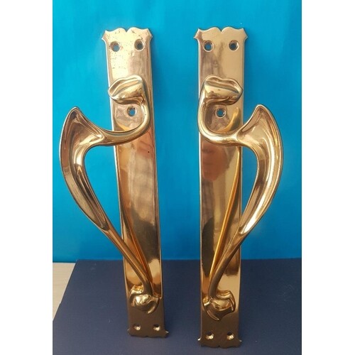 A pair of large drilled brass Art Nouveau Door Handles measu...