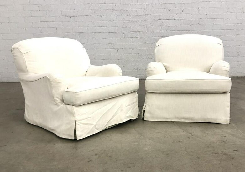 A pair of upholstered club armchairs