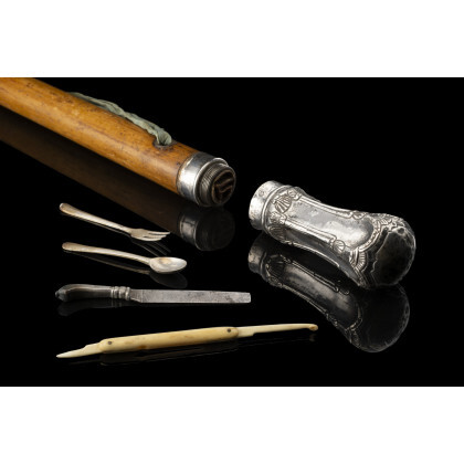 A pic-nic malacca walking stick with a detachable knob hiding a silver and bone cutlery set. Metal toe cap. Naples,...