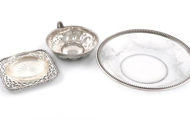 A small mixed lot of silver items, comprising: a French wine taster, circular form, punch bead and fluted decoration, ring-handle, plus a French silver-mounted glass dish, with a beaded border and engraved foliate decoration, and a German silver...
