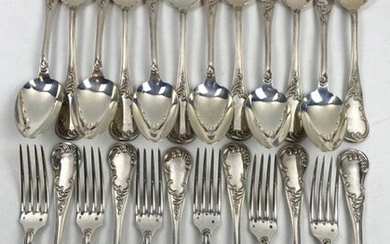 A suite of twelve silver cutlery sets in the rocaille style with foliage decoration and stylized shells.