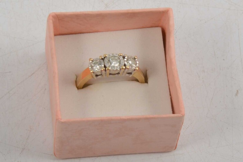 A three stone diamond ring.