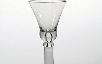 A wine glass c.1740, the base of the bell bowl...