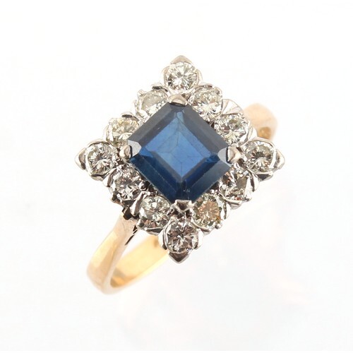 A yellow gold sapphire & diamond cluster ring, the octagonal...