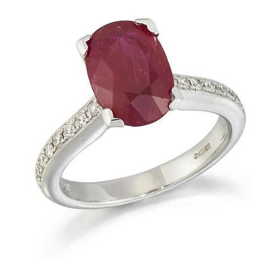AN 18 CARAT WHITE GOLD RUBY AND DIAMOND RING, an