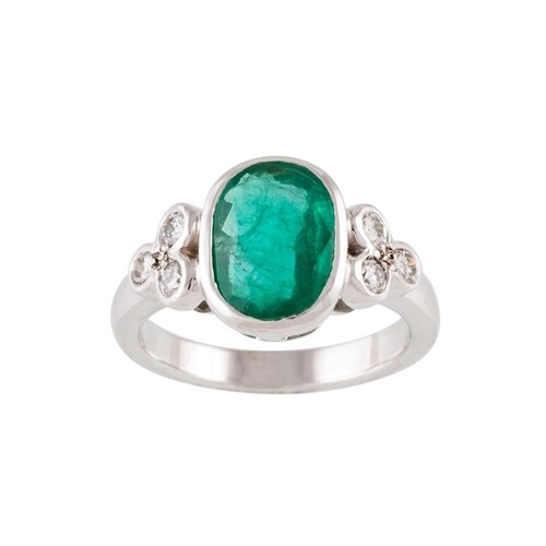AN EMERALD SINGLE STONE RING, the oval emerald collet set to...