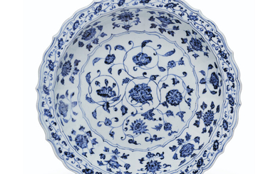 AN IMPORTANT BLUE AND WHITE BARBED 'AUSPICIOUS FLOWER' DISH WITH THE MARK OF SHAH JAHAN, YONGLE PERIOD (1403-1425)