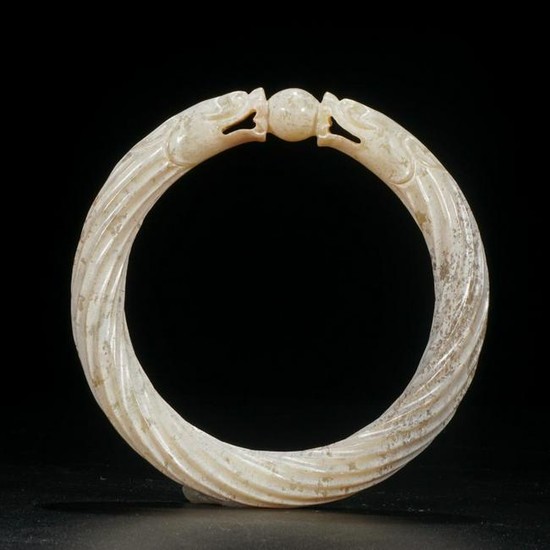 AN OLD HETIAN JADE BANGLE CURVED WITH DRAGON