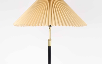 Aage Petersen for Le Klint. Table lamp with stem of black lacquered metal and brass.