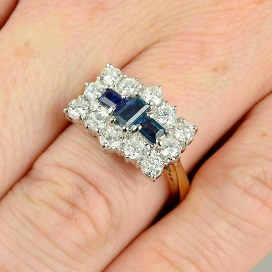 An 18ct gold sapphire and diamond dress ring.Total