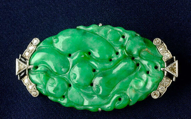 An Art Deco platinum A-Type jade, diamond and onyx brooch.