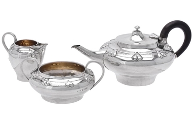 An Art Nouveau silver three piece tea set by Albert Edward Jones