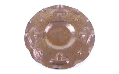 An Arts and Crafts copper circular tray.