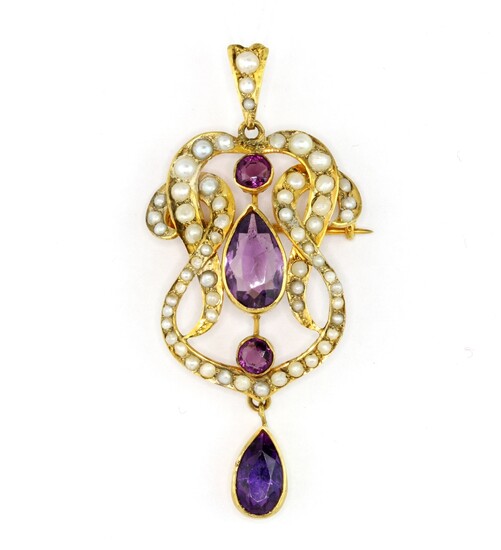 An Edwardian 9ct yellow gold brooch / pendant set with pear and round cut amethysts and seed pearls