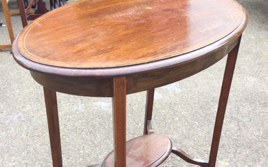 An Edwardian mahogany occasional table with oval moulded chequer strung...