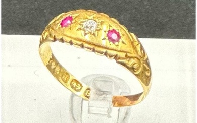An antique 18ct gold diamond and ruby inset ring, approximat...