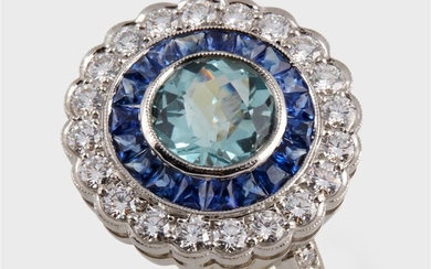 An aquamarine, sapphire, diamond, and platinum ring designed as...