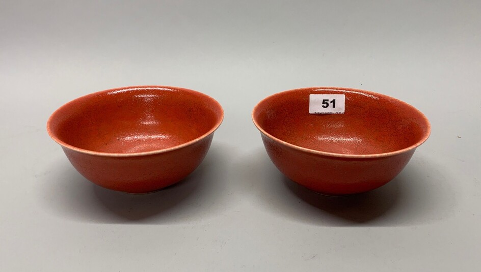 An interesting pair of Chinese orange/red glazed porcelain rice bowls, Dia. 16cm.