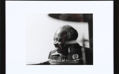 An original black-and-white press photograph of the American jazz legend (William) Count Basie (1904–1984) at the grand piano.