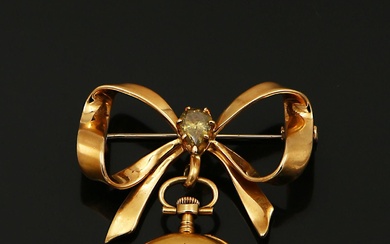 Broche porte montre en or jaune 750/1000e à décor de nœuds de ruban orné au...