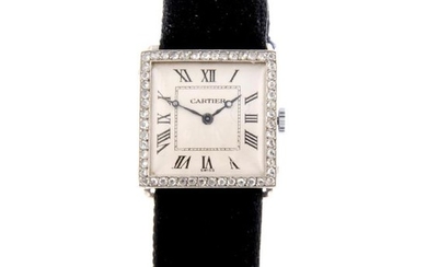 CARTIER - a wrist watch. White metal factory diamond