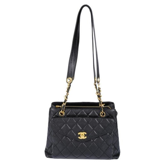 CHANEL - a quilted Caviar leather handbag. Featuring a