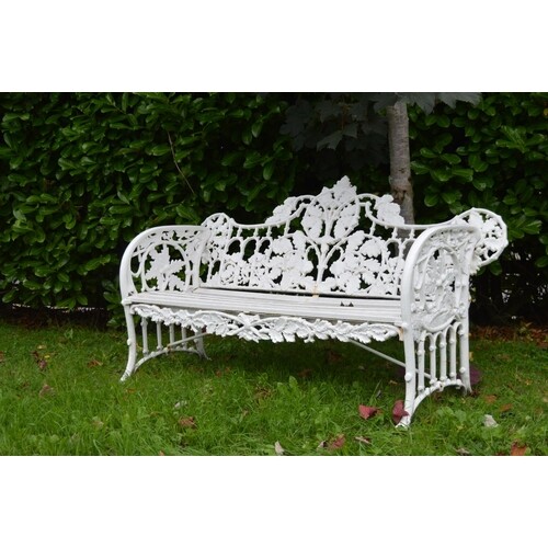 Cast iron garden bench in the Coalbrookdale style with oak l...