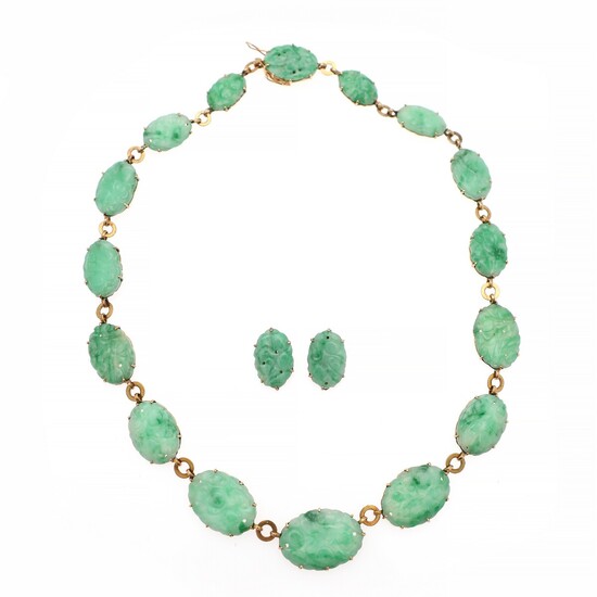Chr. Rasmussen a.o.: A jadeite jewellery set comprising a graduated necklace and a pair of ear clips each set with carved jadeite, mounted in 14k gold. (3)