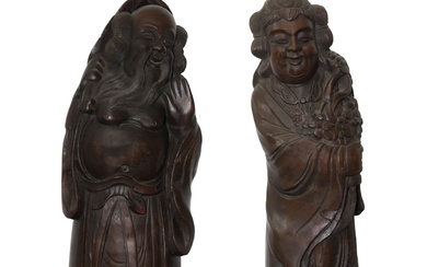 Coppia di sculture in legno di bamboo raffiguranti un uomo e una donna