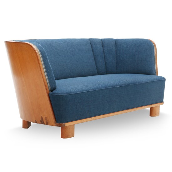 Danish furniture design: Curved sofa with beech legs, light mahogany shell. Upholstered with blue wool. Manufactured by Søren Willadsen, 1940s.