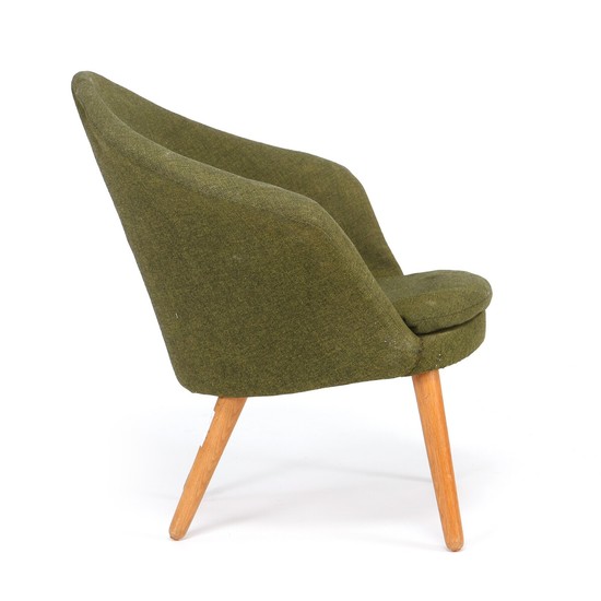 Danish furniture design: Easy chair with round, tapering oak legs. Sides, seat and back upholstered with moss green wool fabric.
