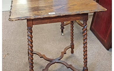 EARLY 20TH CENTURY OAK TABLE WITH SHAPED TOP ON BARLEY TWIST...