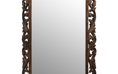 Elizabethan style mirror with frame in carved and gilt wood, circa 1930.