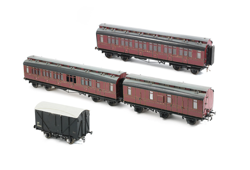 Four 1½ inch gauge passenger carriages and goods wagons