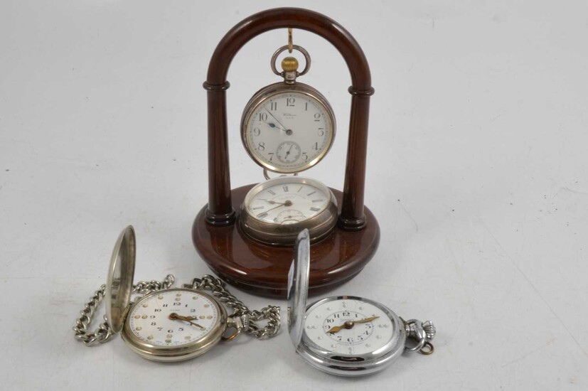 Four pocket watches and stand .