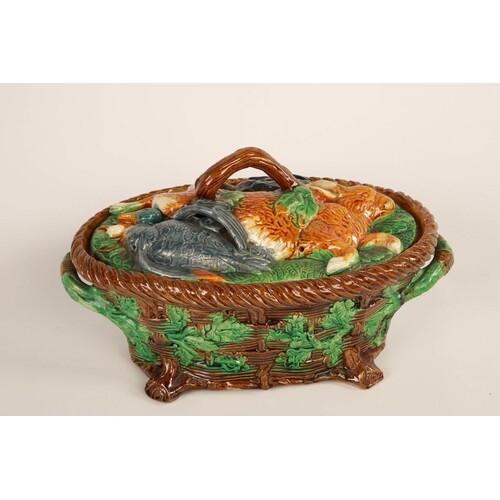 George Jones; a Majolica game pie dish and cover of oval for...
