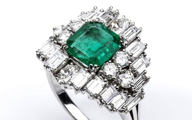 Gold, emerald and diamonds ring 18k white gold ring, set with central emerald surrounded by...