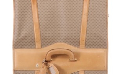 Gucci: A garment bag made of brown monogram kanvas and light brown leather details, with five hangers and a luggage tag.