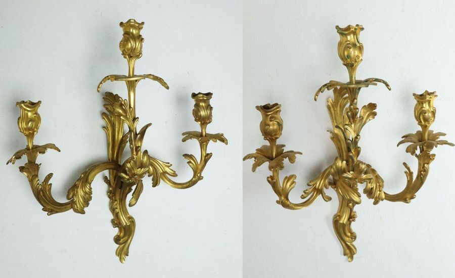 Important pair of gilt bronze sconces with three lights.
