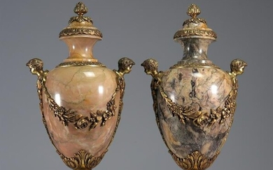 Imposing pair of marble and bronze cassolettes decorated with heads and flowers